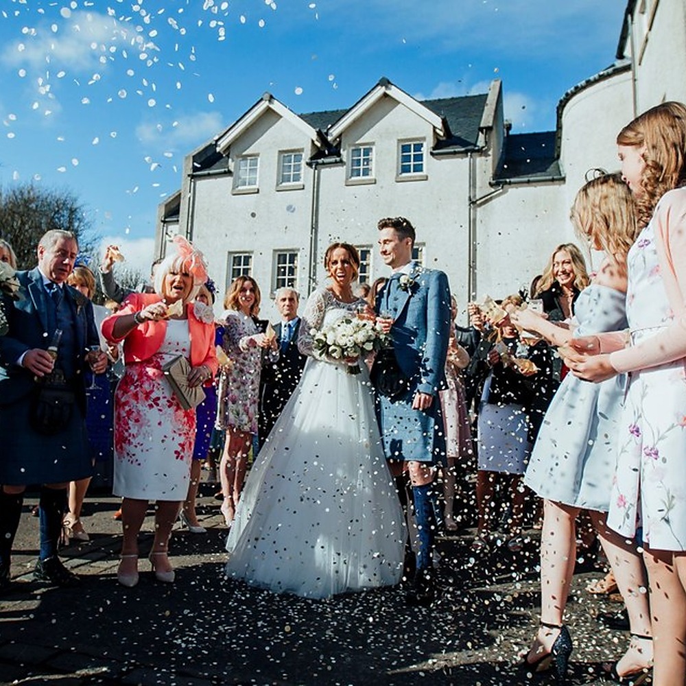 Wedding celebration outside Glenskirlie Castle Hotel