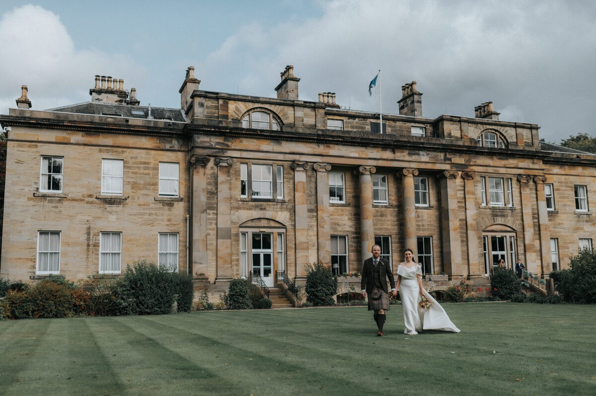 Balbirnie House Hotel Georgian facade with a newly married couple