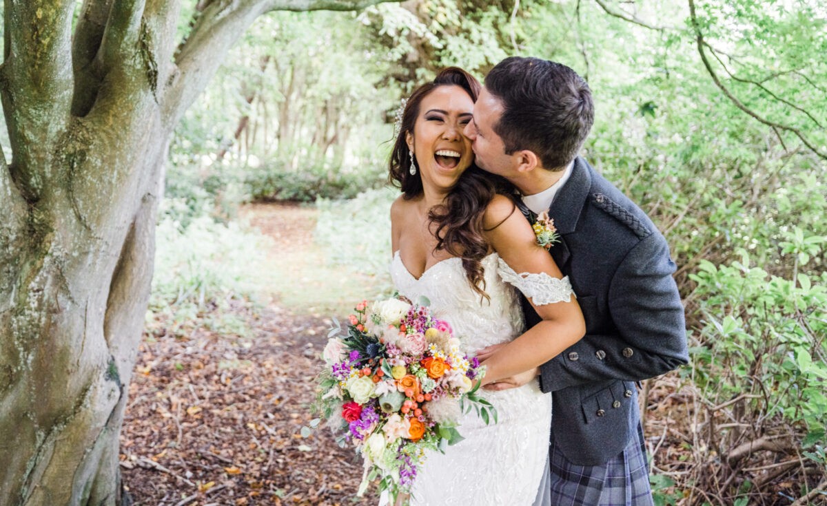 Newly married couple in the woodland at Balbirnie Park