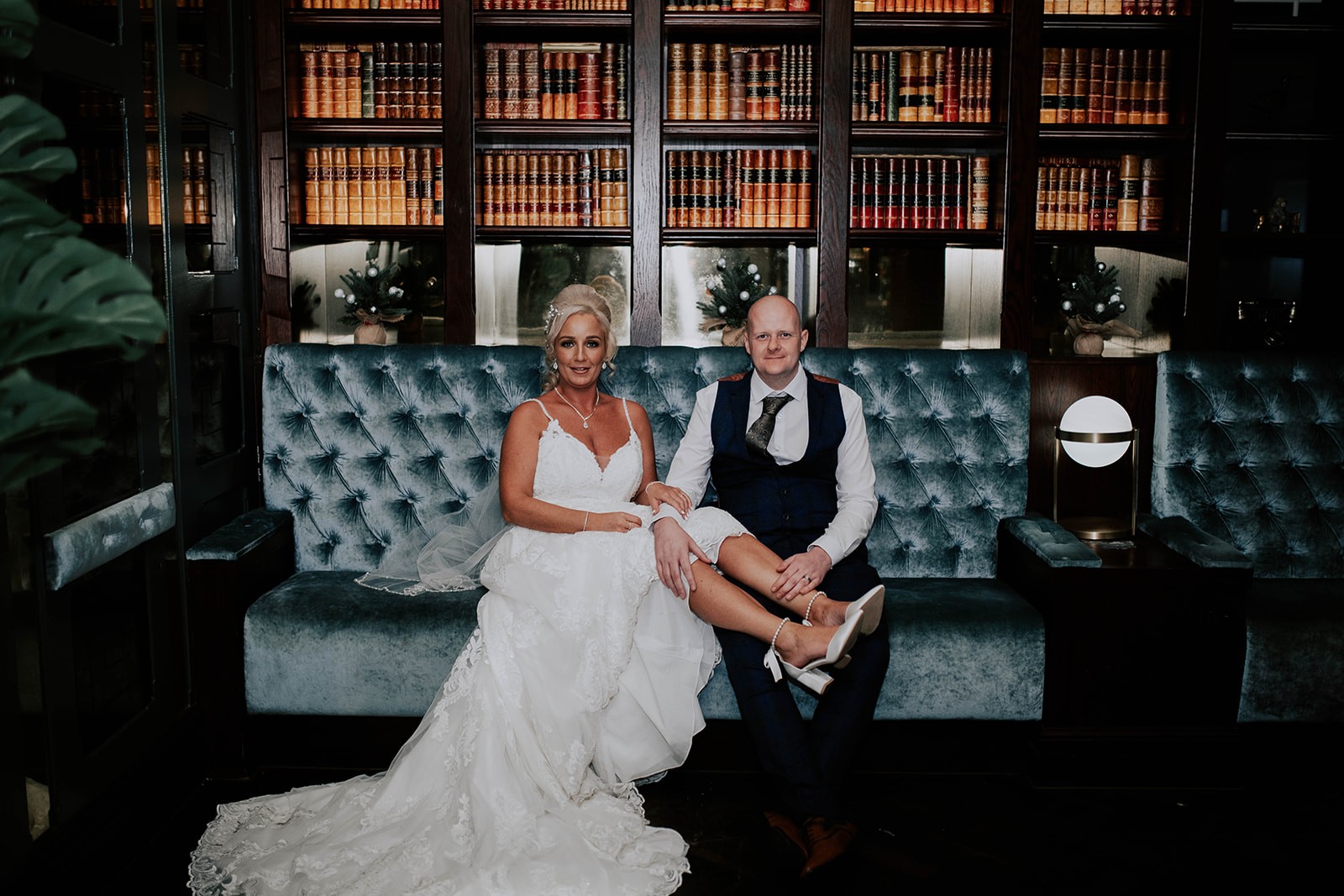 Newly married couple seated in the library at Boclair House