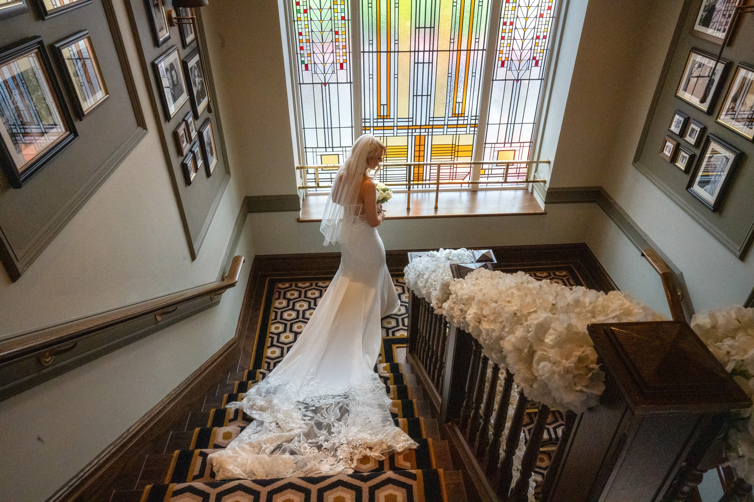Bride beside the stained-glass window at Boclair House