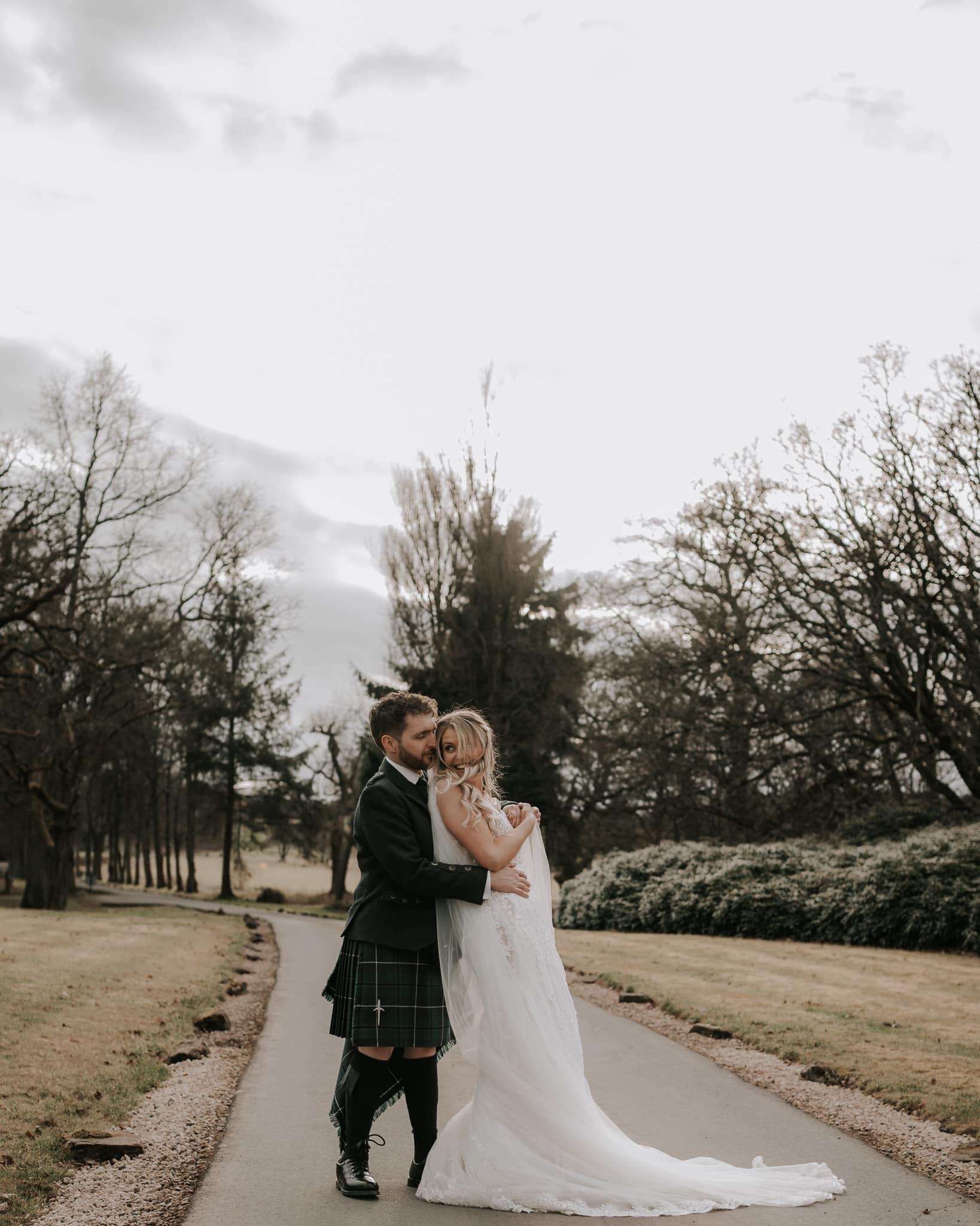Newlyweds photographed in Glenbervie’s winter grounds.