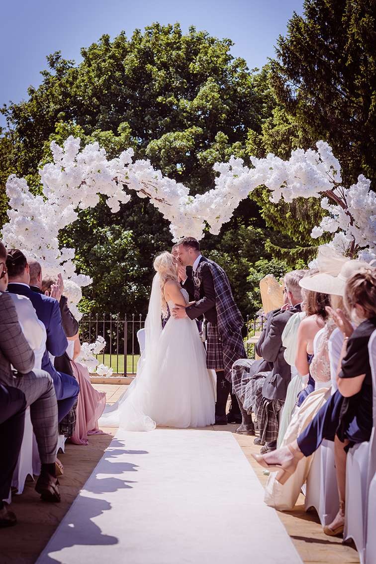 Outdoor wedding ceremony at Glenbervie House.
