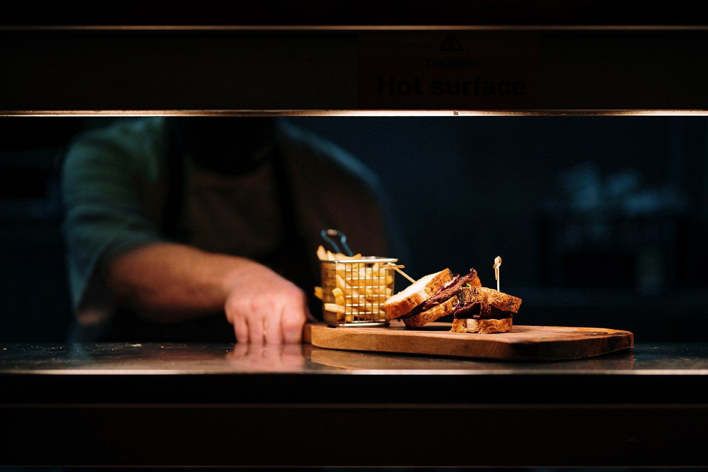 Chef presenting a dish in Glenskirlie’s Abbey Restaurant.