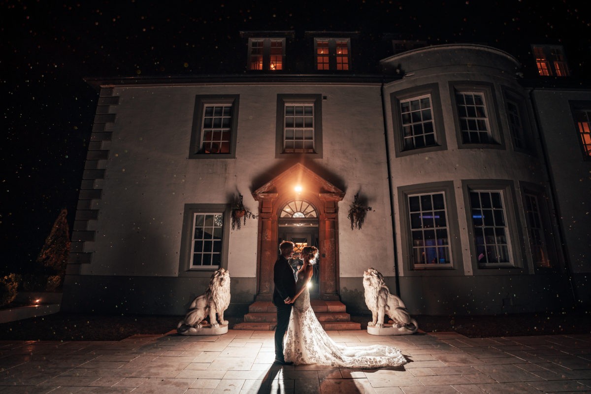 Night-time wedding portrait at Hetland Hall.