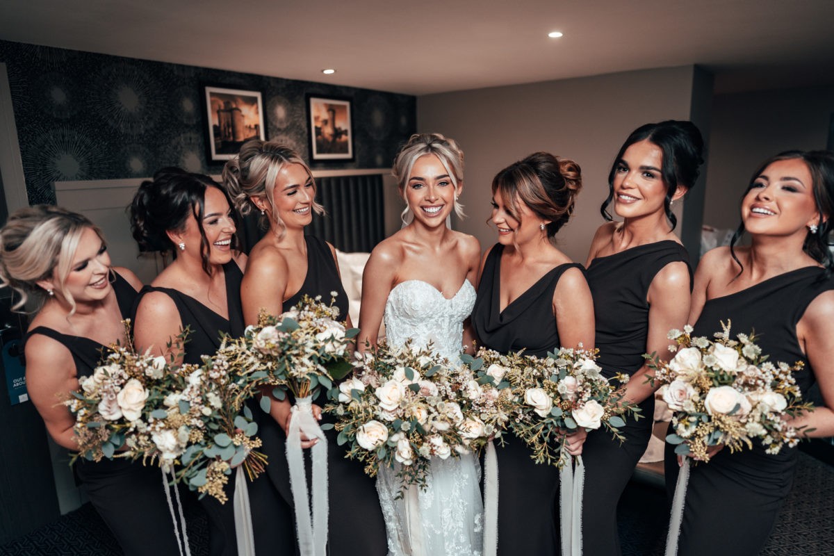 Bride with attendants and bouquets at Hetland Hall.