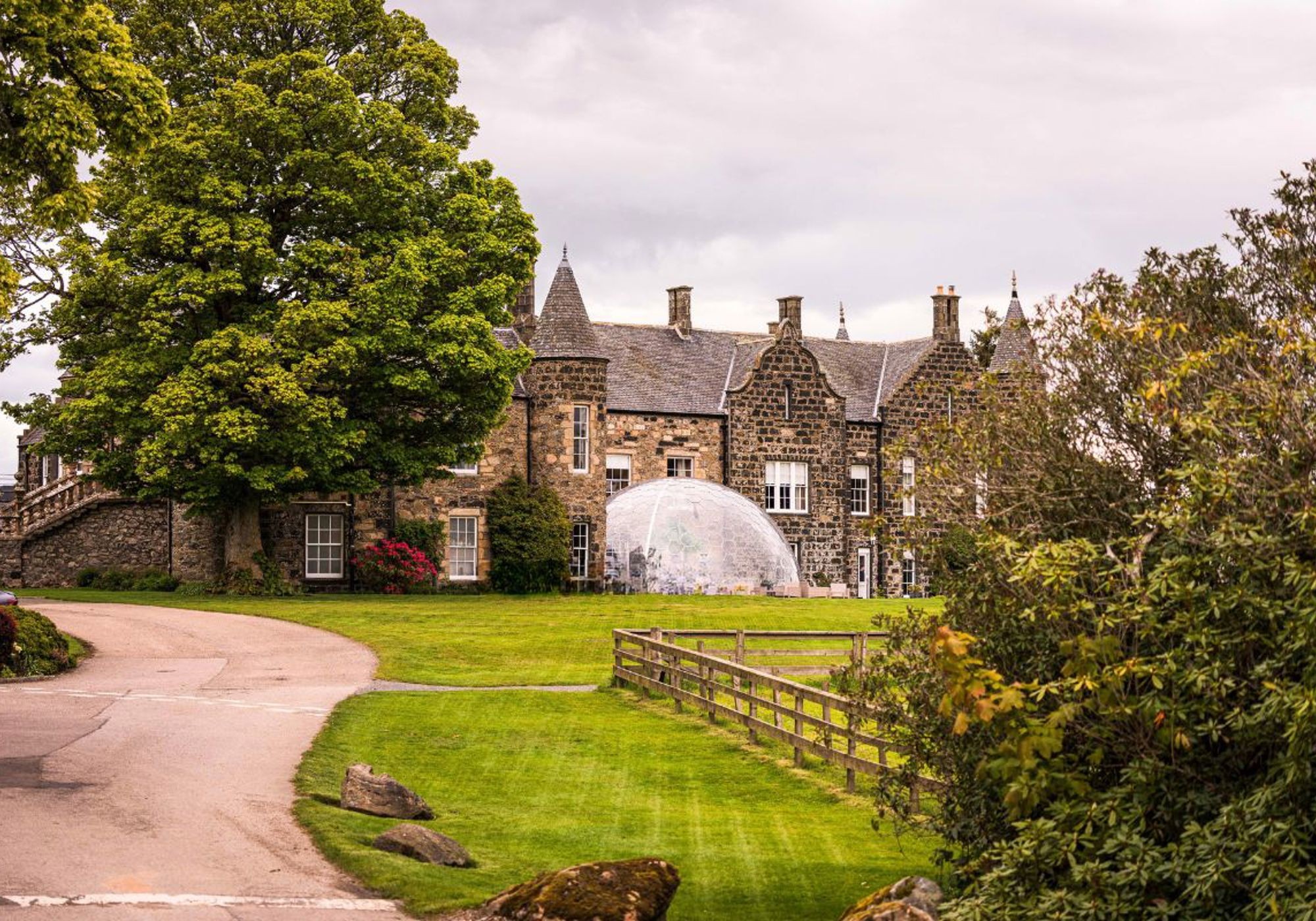 Meldrum House manor approached along the estate drive.