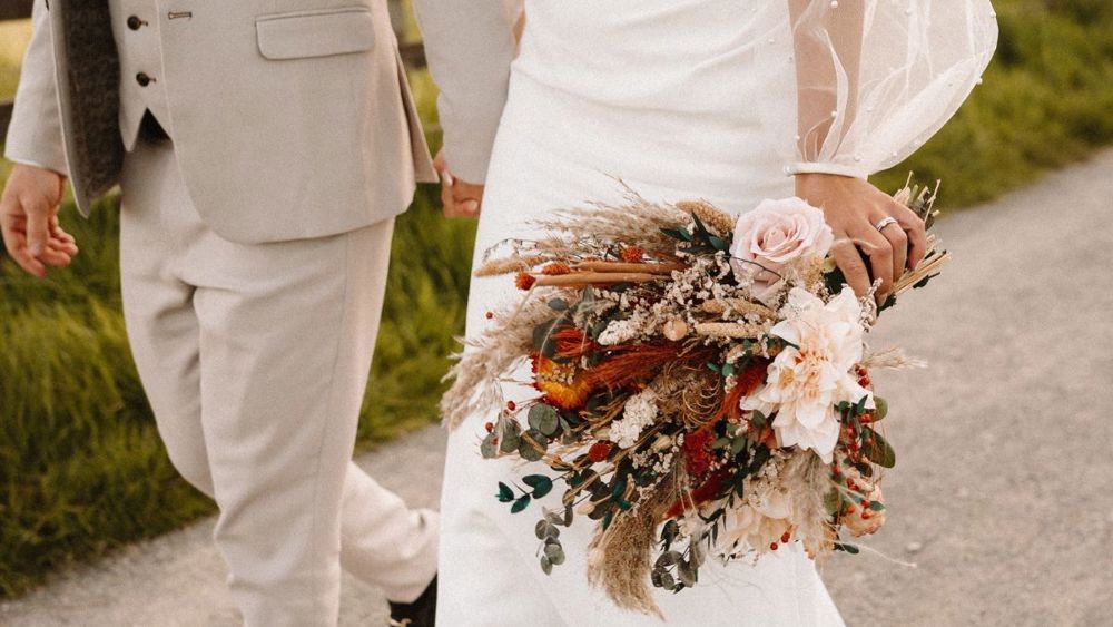 Bride holding a seasonal bouquet at Meldrum House.