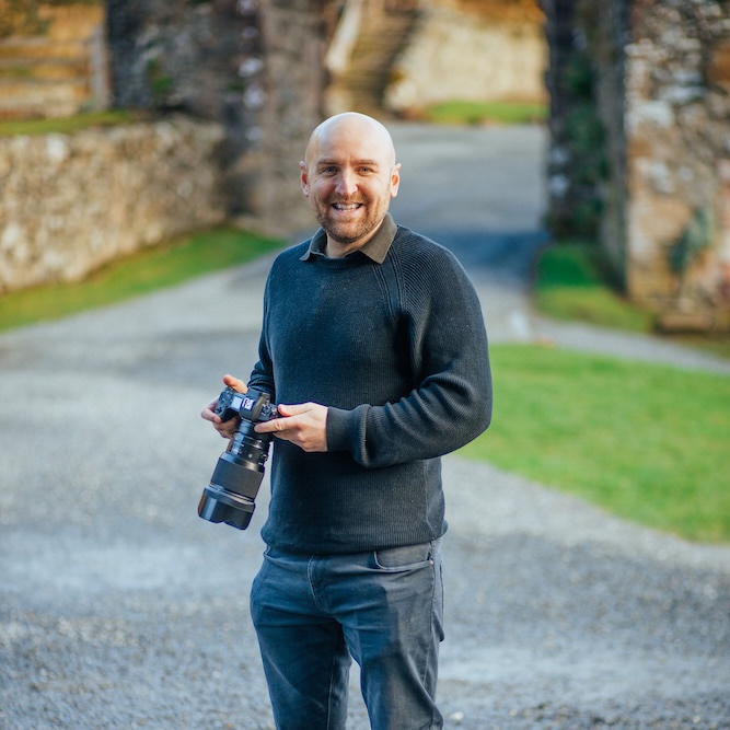 Lloyd Stevenson holding a camera